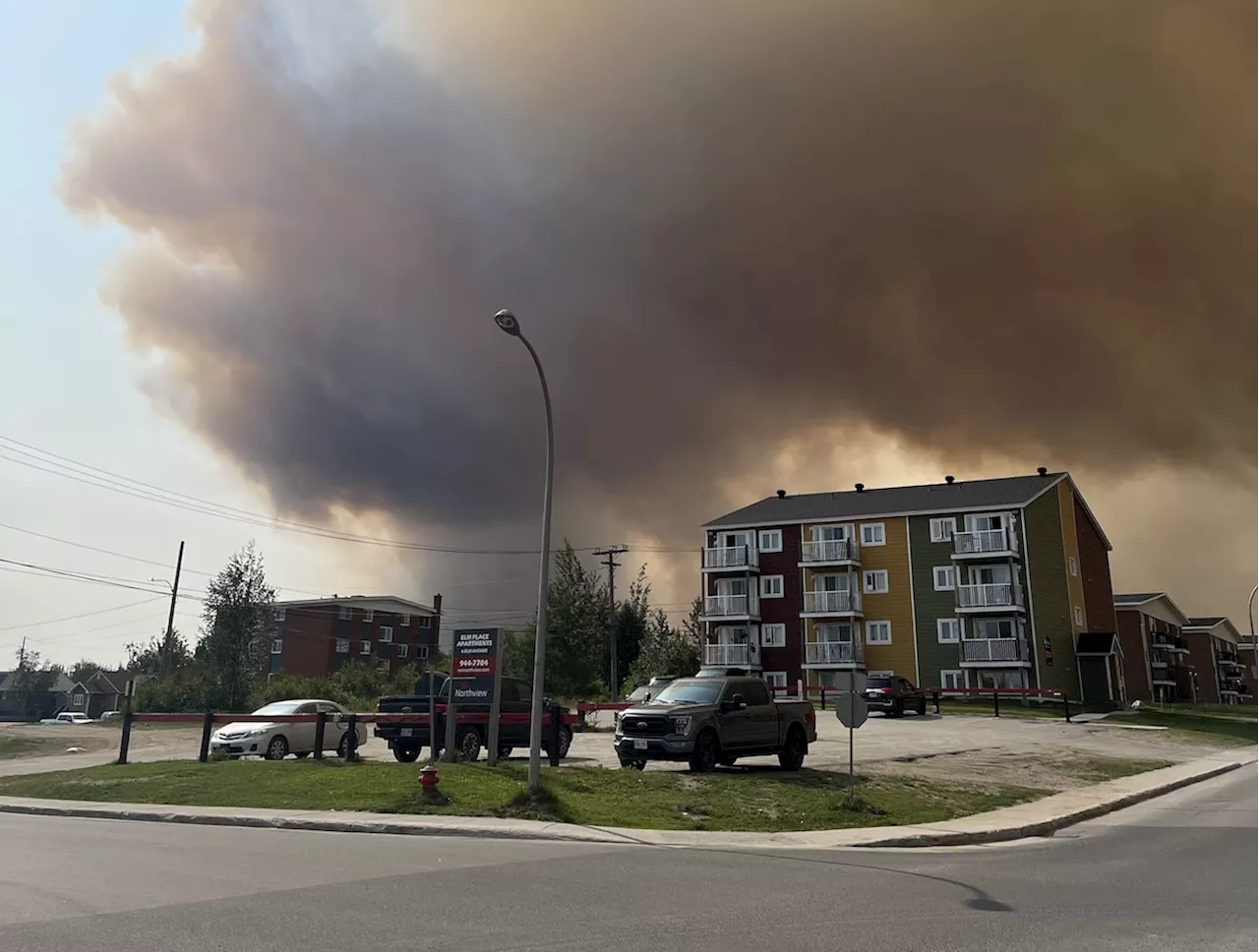 Premier says weather cooperating as firefighters attack Labrador City blaze