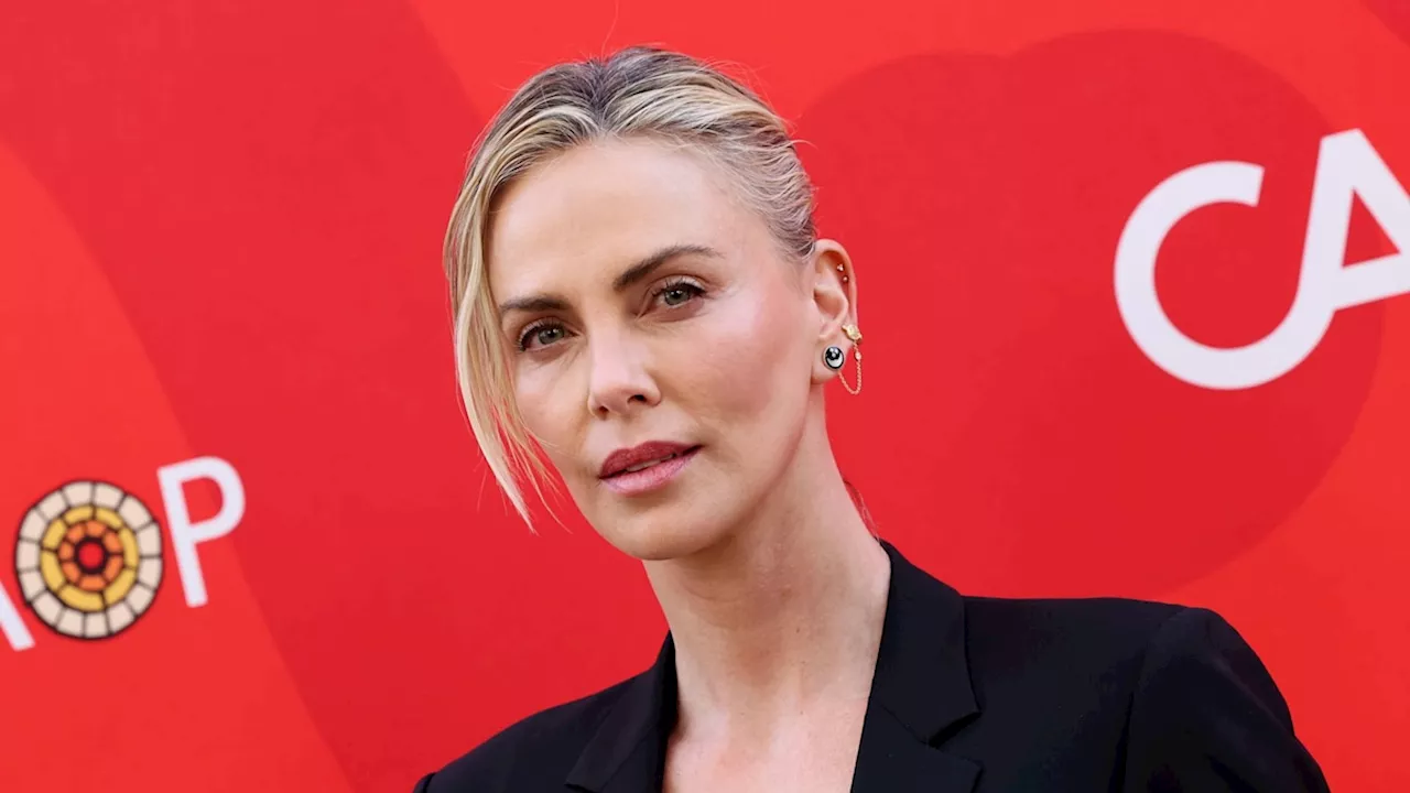 Charlize Theron steps out in a daring black bra and blazer combo as she hosts star-studded affair — photos