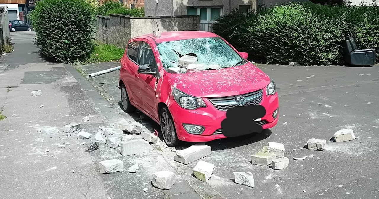 Thugs throw bricks on top of car 'from abandoned building' in Glasgow