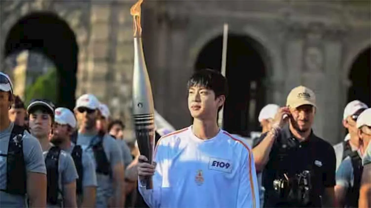 BTS member Jin carries iconic torch through Paris streets ahead of Olympics 2024