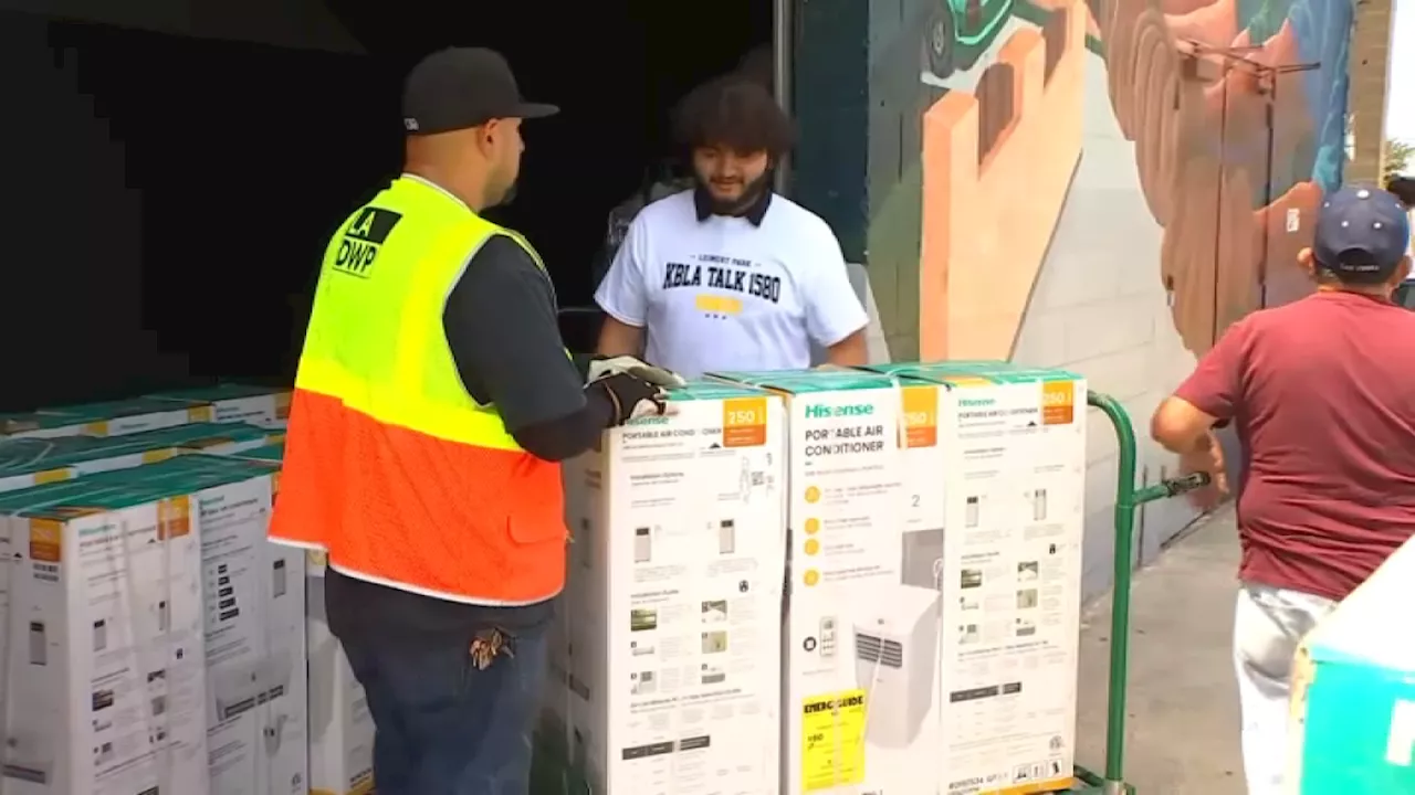 Senior citizens in Watts receive free portable ACs