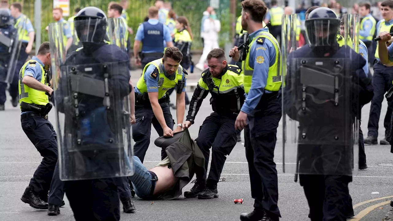 Protesters attack police and set fires outside Dublin asylum seeker site