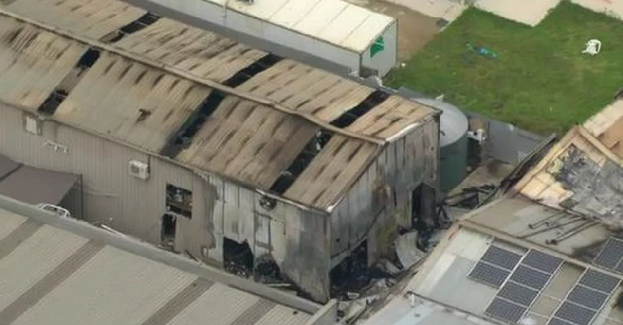 Two men charged with arson after fatal factory fire in Melbourne's west