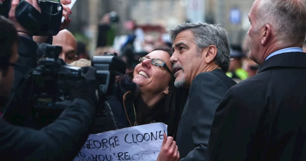 George Clooney arrives in Edinburgh as he poses for selfies with fans