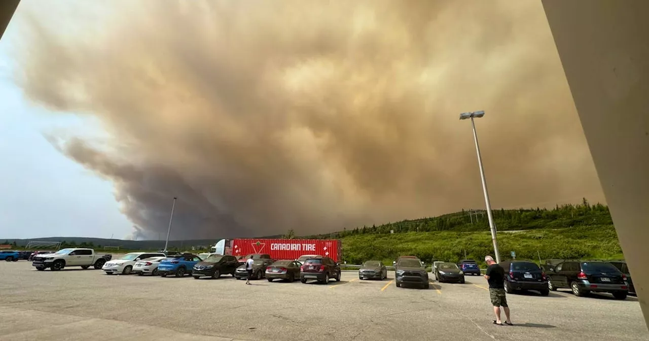 Residents from Labrador City evacuate with their pets in tow