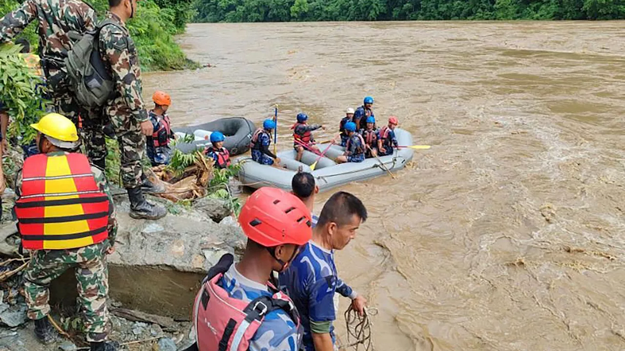 Nepal: 14 bodies found after buses swept into river by landslide, officals say