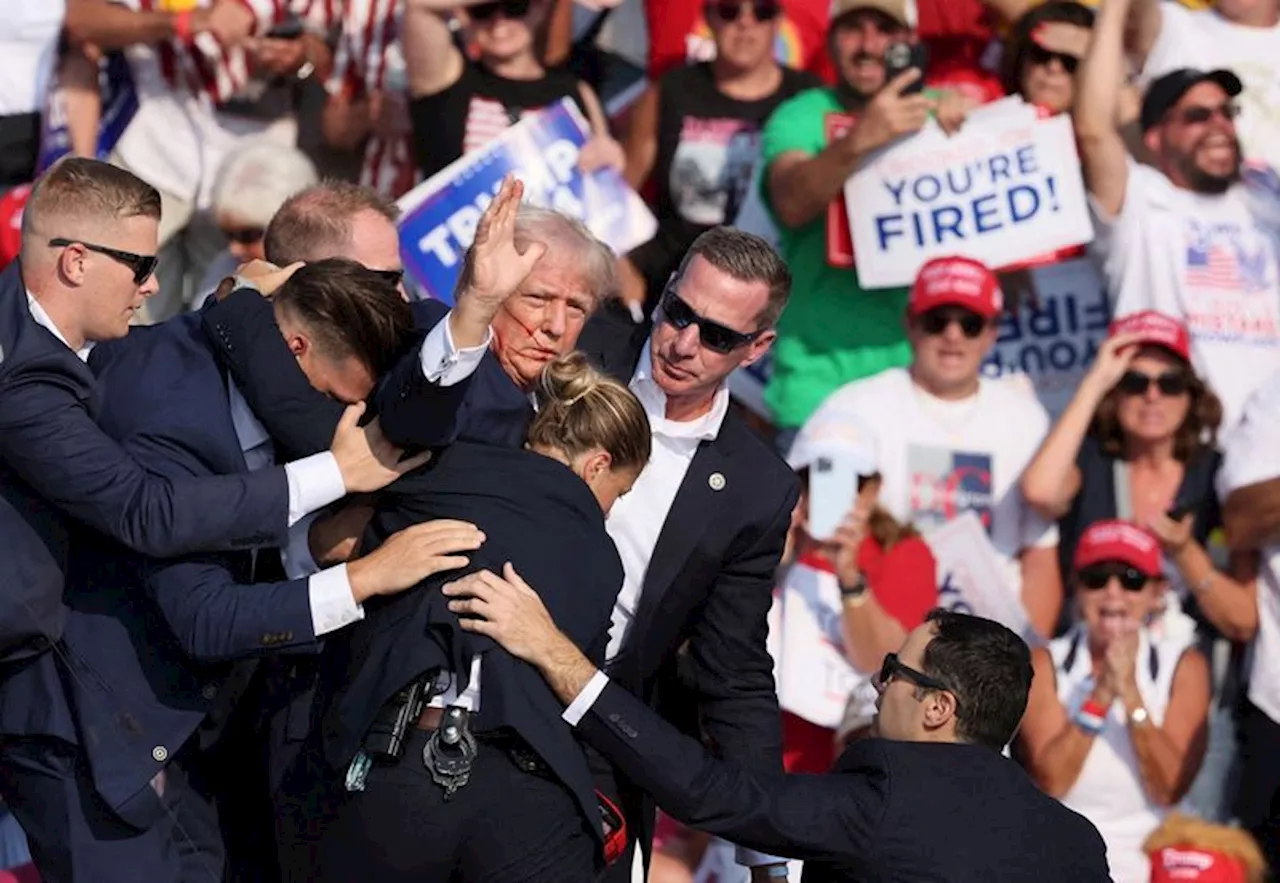 Trump appears with bandaged ear at Republican convention, names Vance as running mate