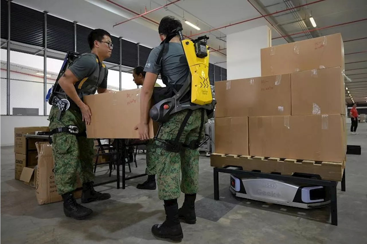 Soldiers don exoskeleton suits, operate automated packing line to prepare 2024 NDP packs