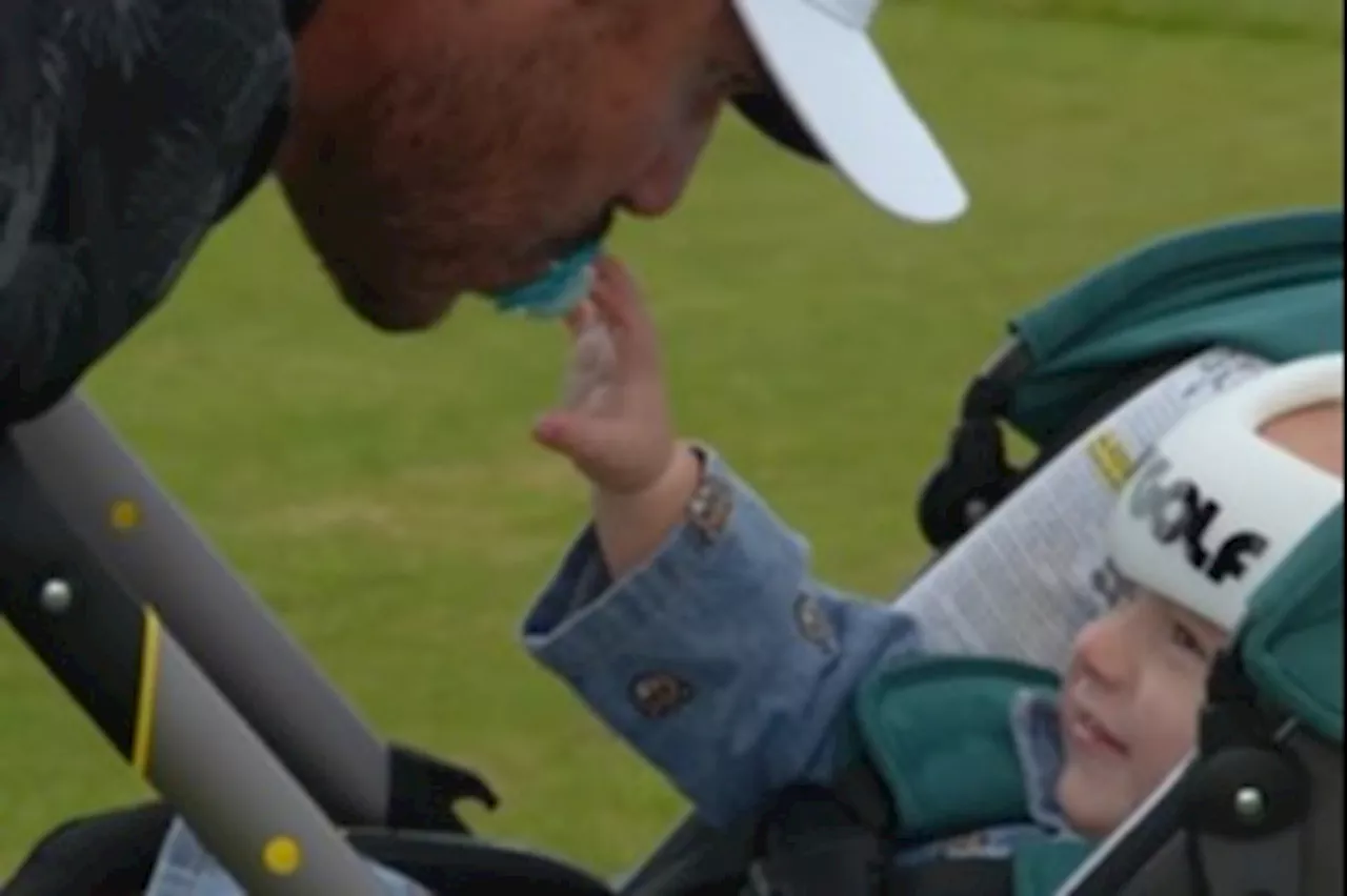 Brooks Koepka ‘throws wife under bus’ as he looks after their baby Crew on the driving range at The Ope...