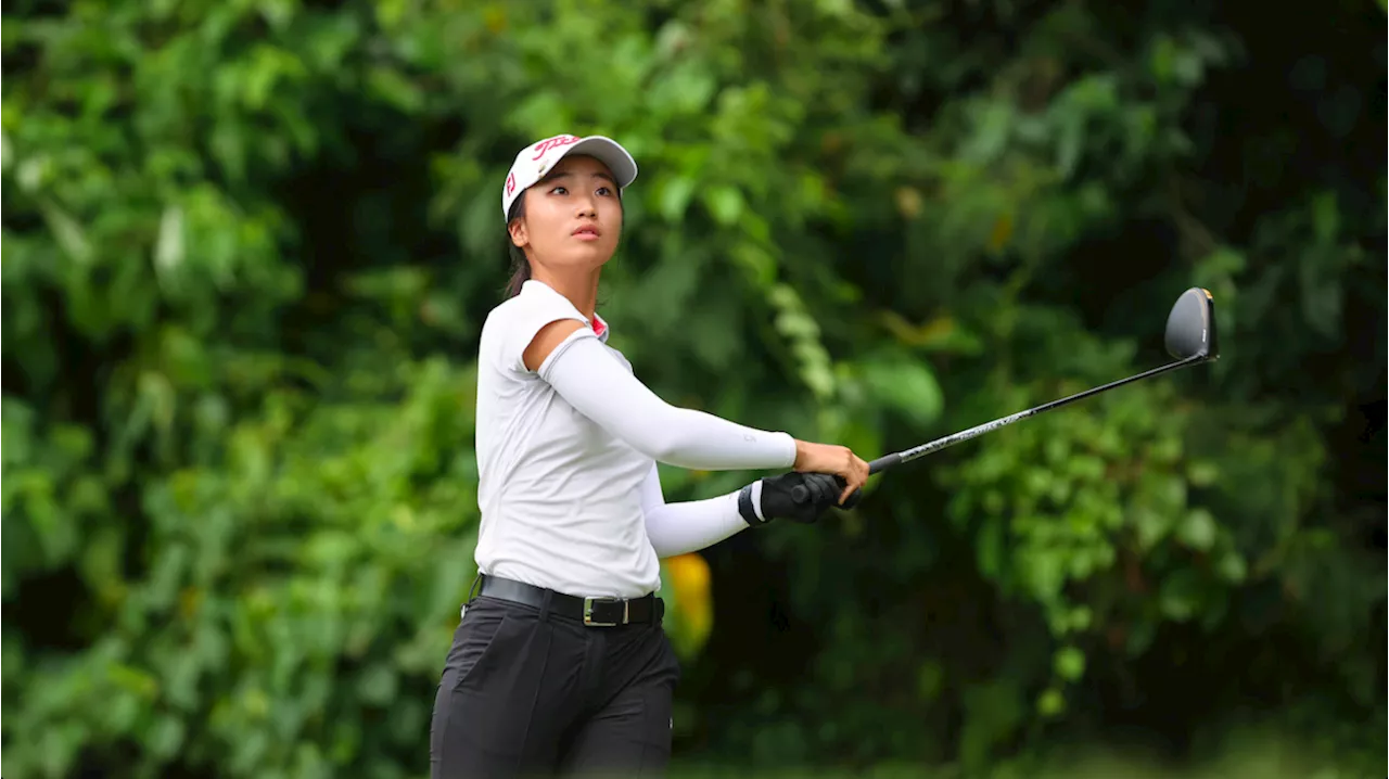 Lee shines in challenging conditions, leads by 1