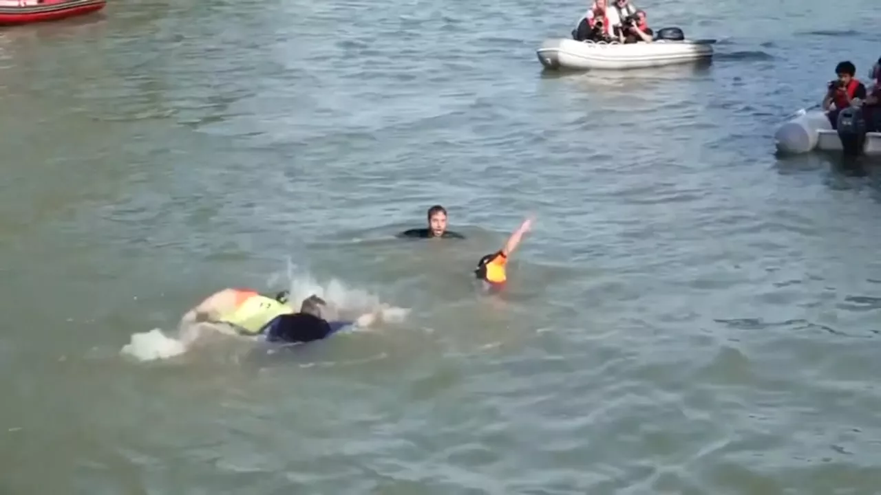 Paris mayor swims in Seine to show how clean the water is ahead of 2024 Olympics