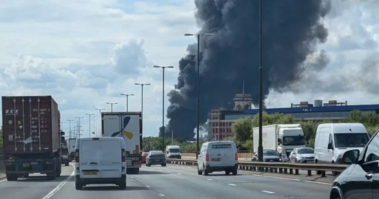 Huge plumes of smoke billow from building after fierce blaze brakes out