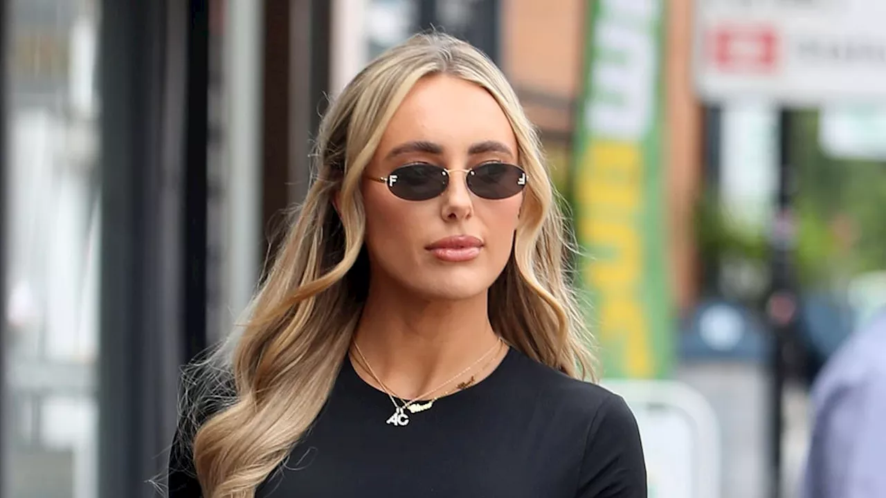 TOWIE's Amber Turner flaunts her toned abs in a crop top as she as she returns to filming with BFFs...