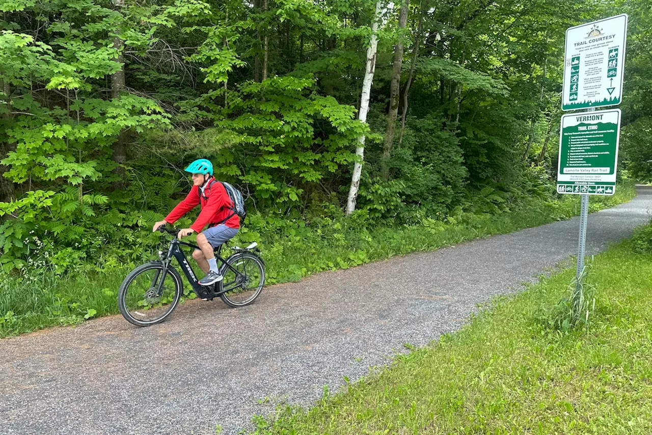 Hikers and cyclists can now cross Vermont on New England’s longest rail trail, a year after floods