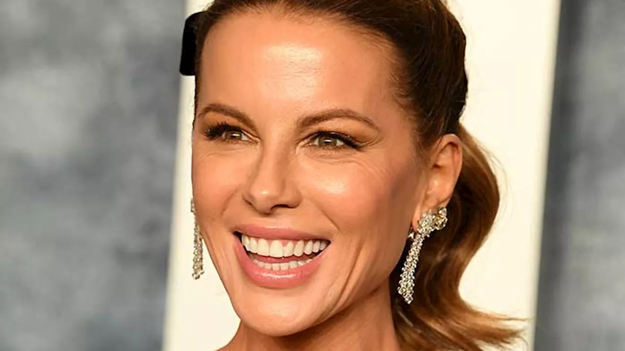 Kate Beckinsale showcases washboard abs in micro bikini in new photos