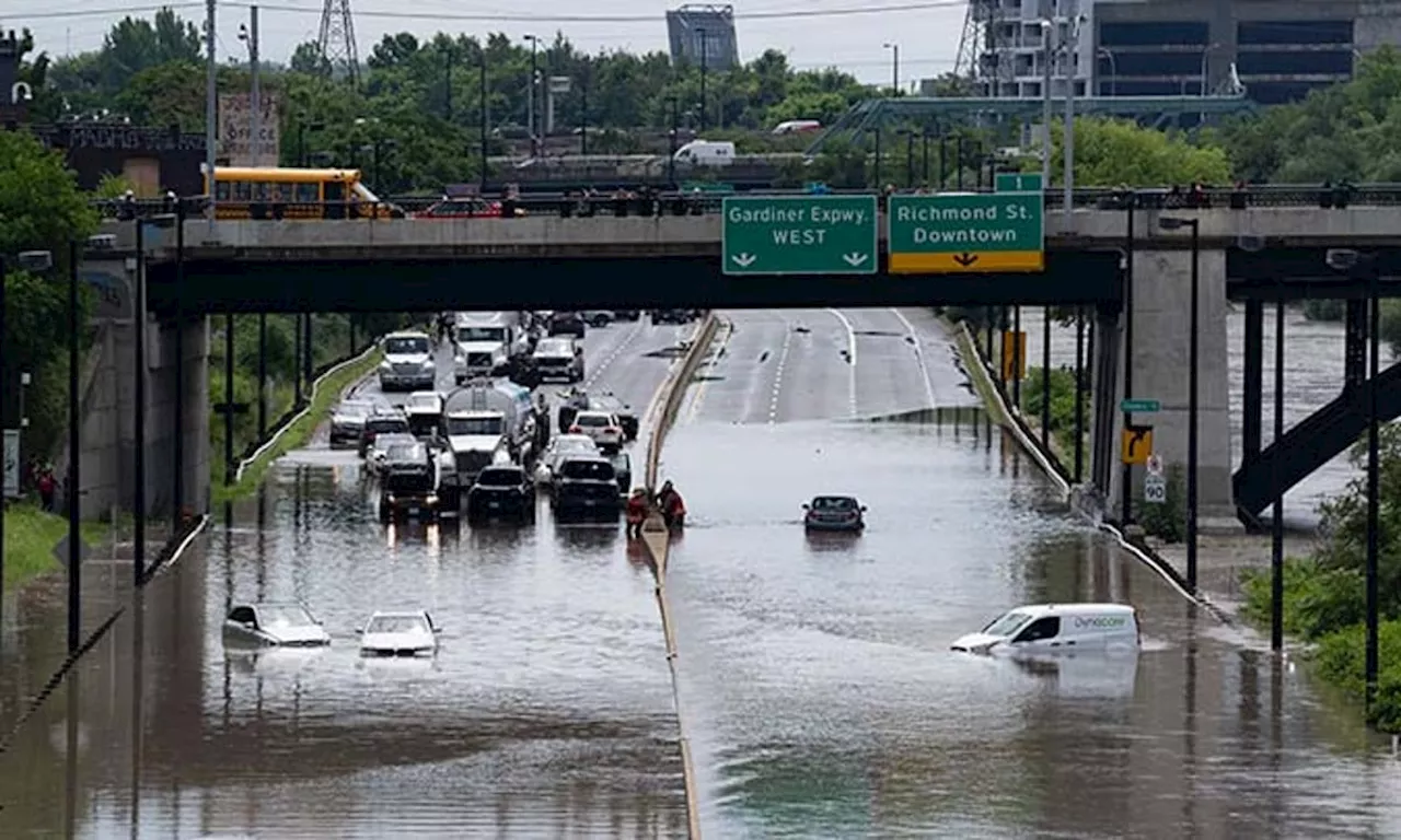 Torrential rains hit Canada's largest city, closing a major highway and other roads