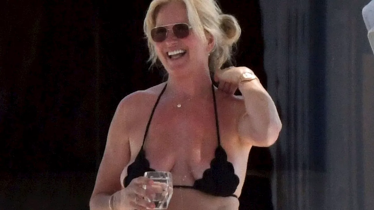 Rod Stewart’s wife Penny Lancaster, 53, soaks up the sun in a barely-there bikini on star’s £50millon yach...