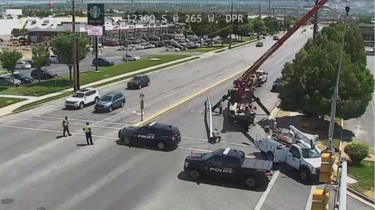 Draper traffic light destroyed by dump truck with bed hoisted