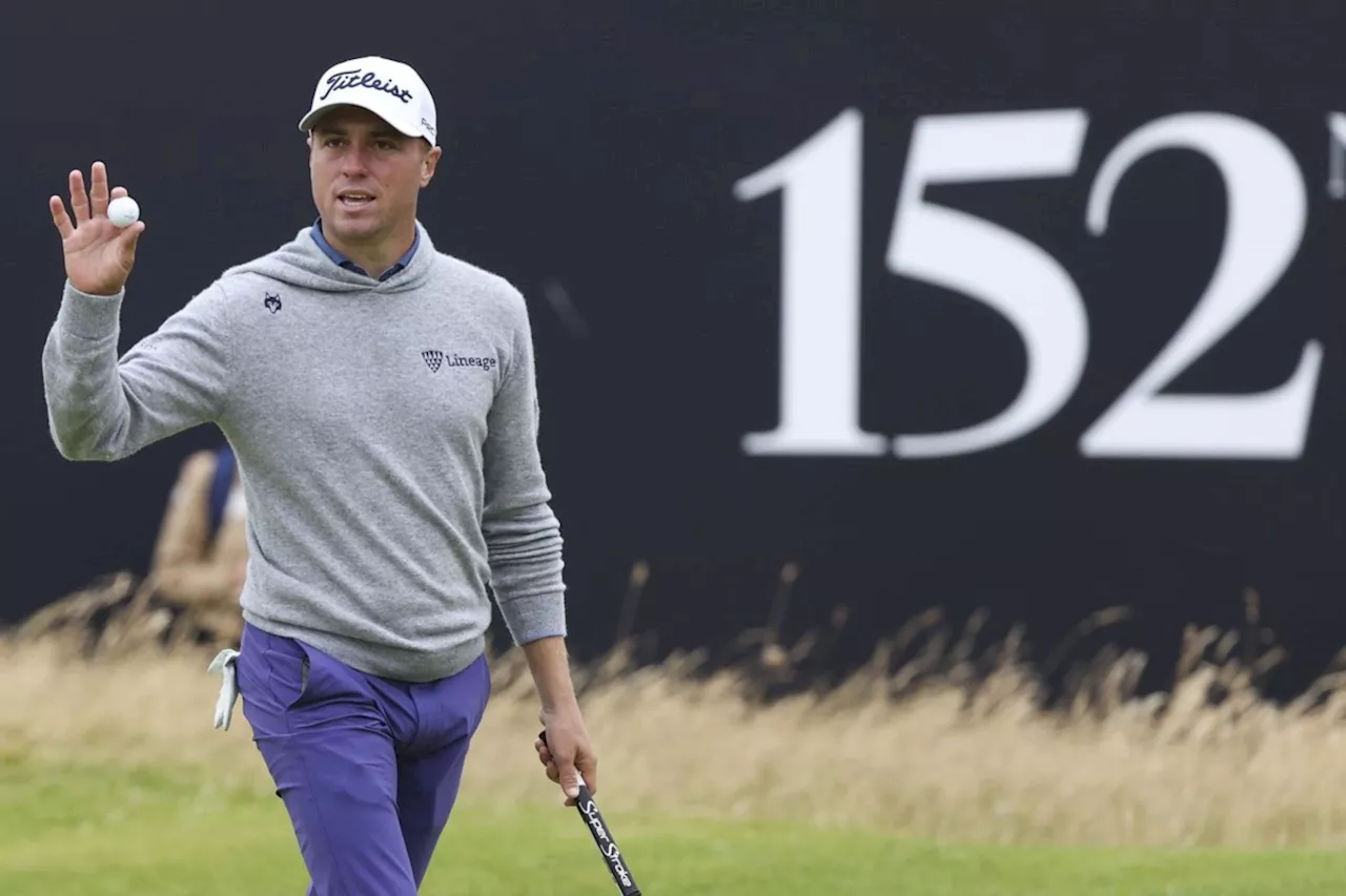 Thomas steadies himself in the wind and rain at Troon for early British Open lead