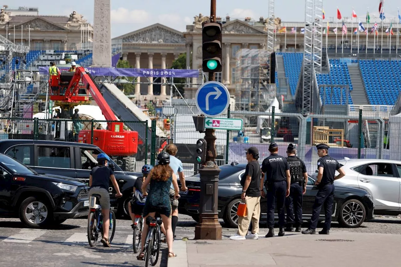 Central Paris locks down for Olympics as athletes arrive