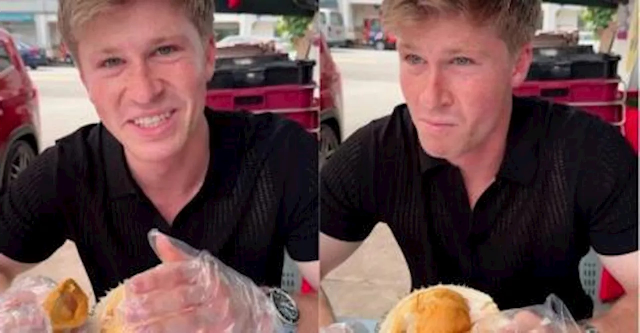 Robert Irwin struggles with durian during first try in Singapore