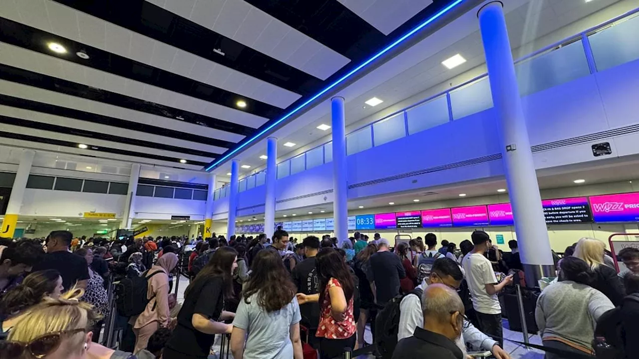 Microsoft meltdown sparks travel chaos across the UK: Huge queues form at airports with Ryanair...