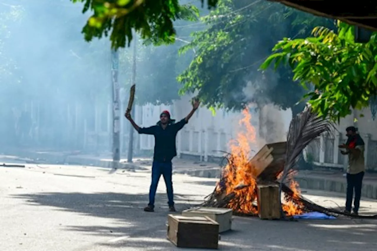 Bangladesh protesters set state TV HQ ablaze as toll mounts, internet cut