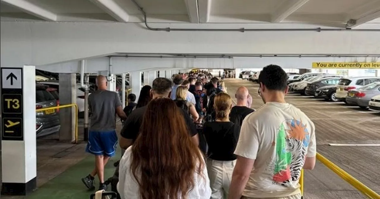 Manchester Airport passengers stuck in queues snaking out of terminal