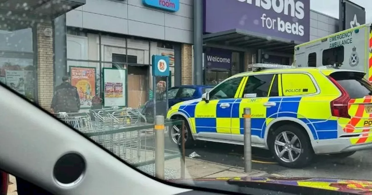 Car ploughs into Scots retail park shop as emergency services race to scene