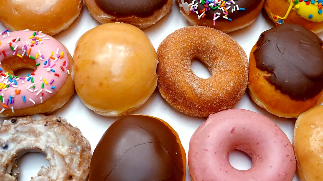 Krispy Kreme is giving away free doughnuts, iced coffee in July