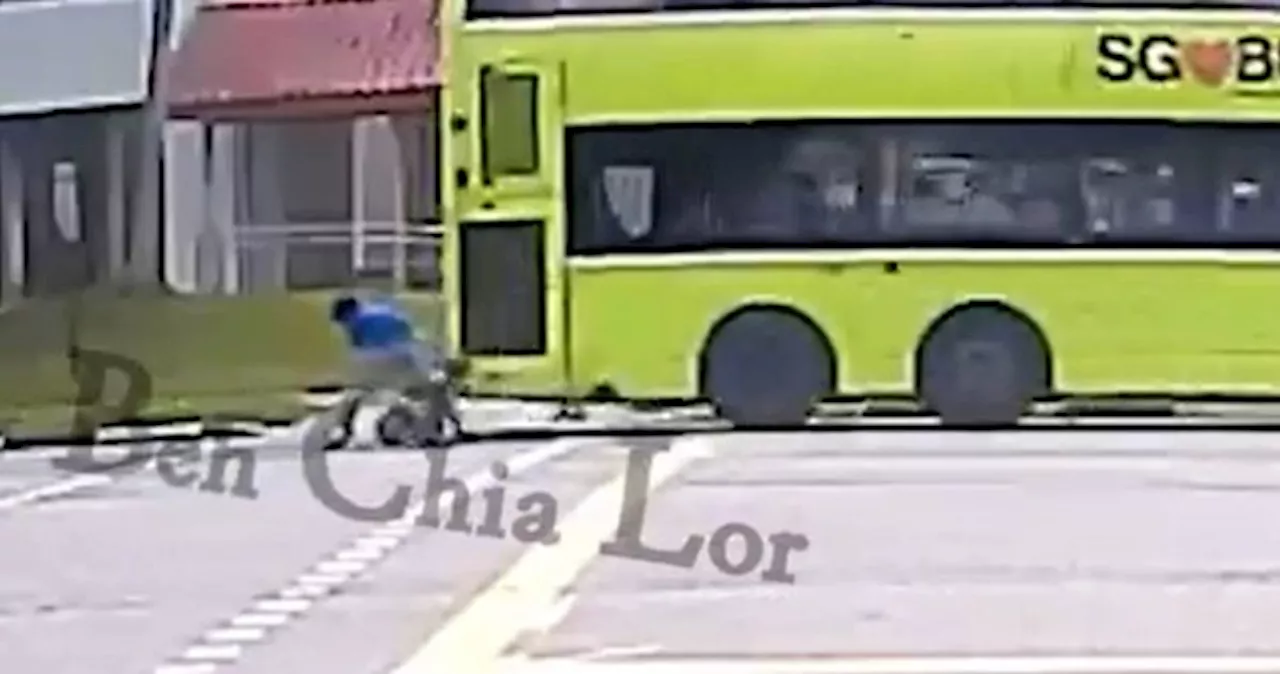 PMD user almost gets hit by bus after beating red pedestrian traffic light in Yishun