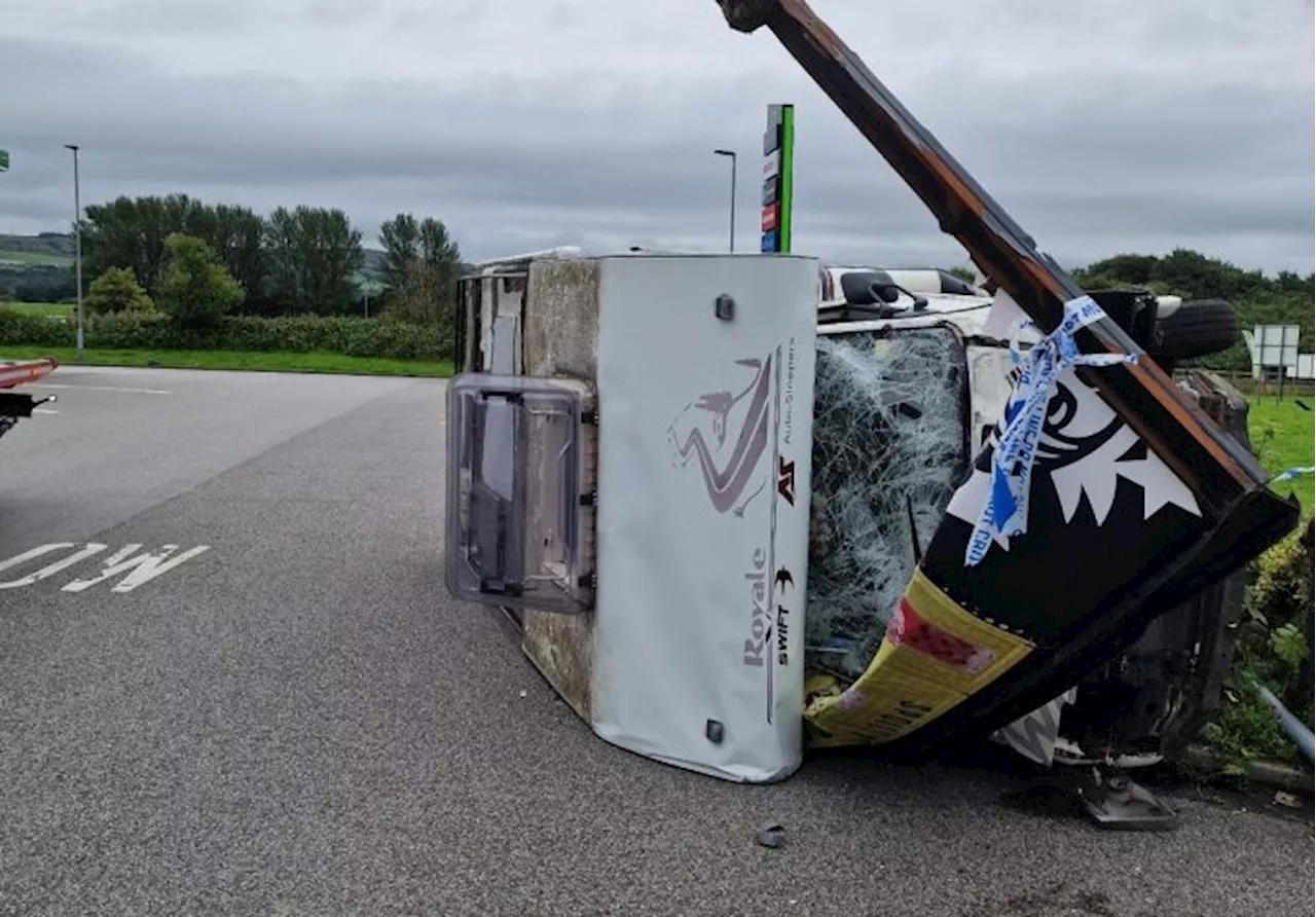 Emergency services dealing with flipped vehicle at M61 Rivington Services