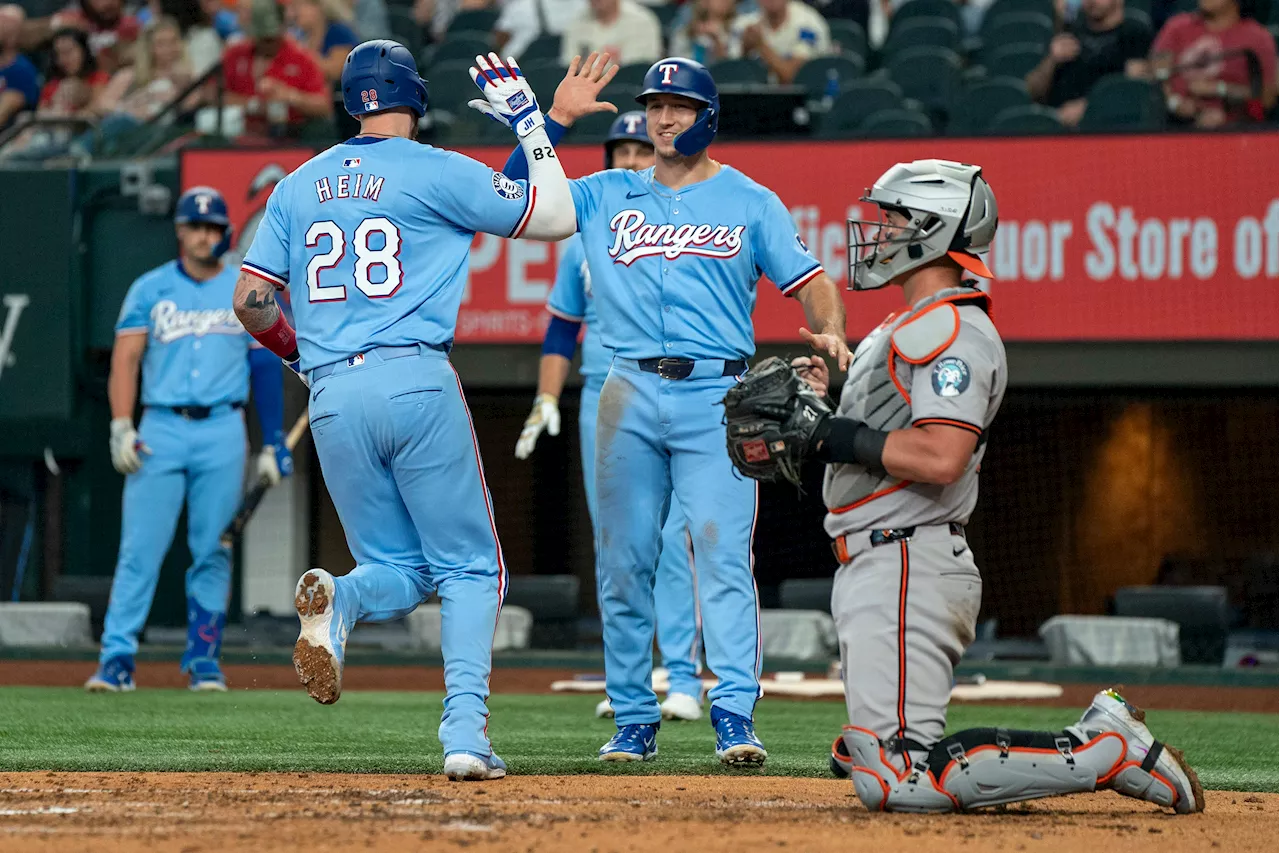 Heim homers, Heaney solid as Rangers beat Orioles to avoid sweep