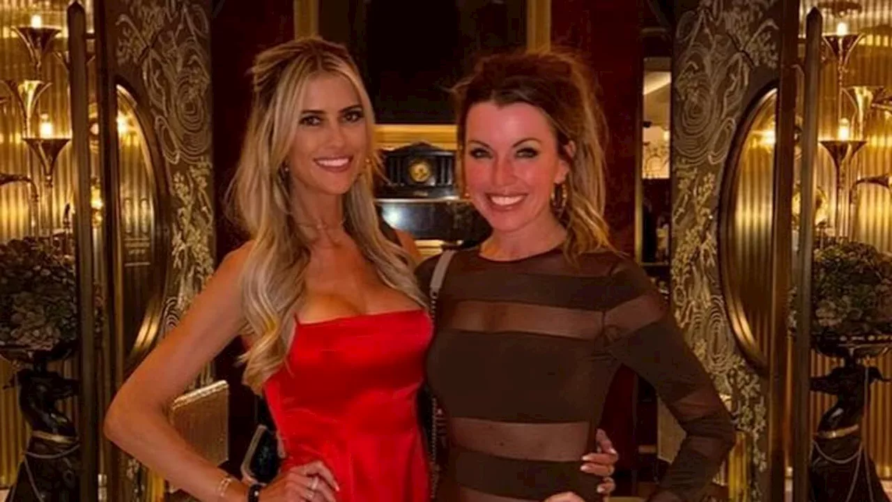 Christina Hall parties with a gal pal in Las Vegas rocking a racy red dress