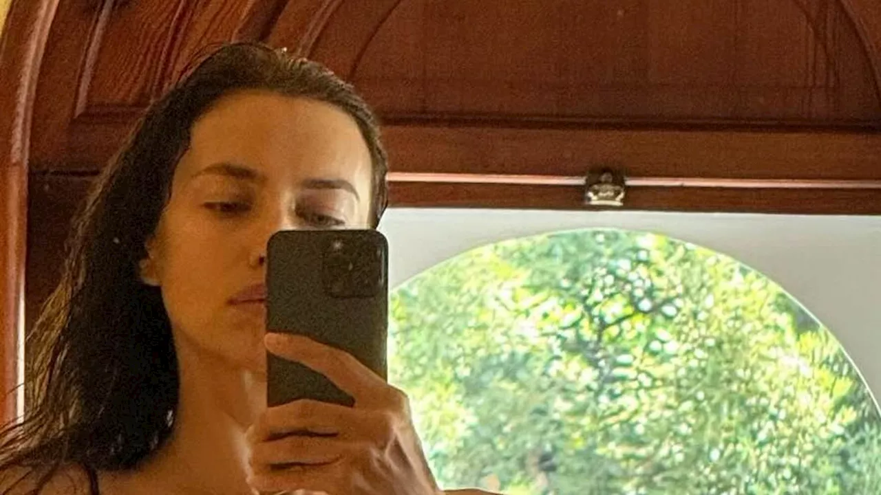 Irina Shayk shows off her extremely toned physique in a black bikini while on vacation: 'I love...