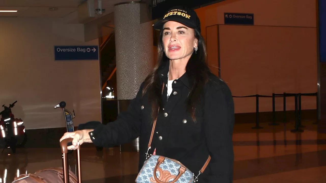 Kyle Richards arrives back in LA after supporting gal pal Morgan Wade in Minnesota