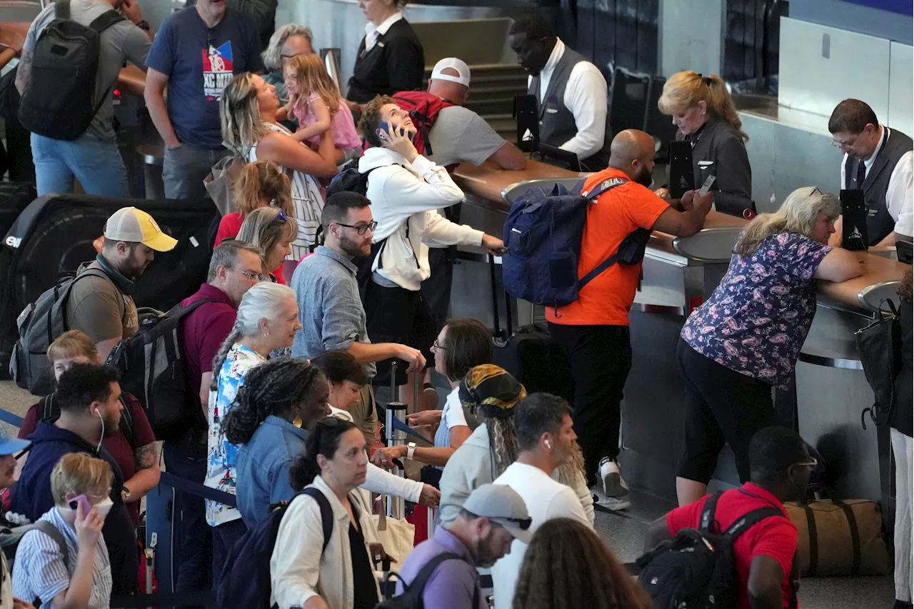 Delta Air Lines says cancellations continue as it tries to restore operations after tech outage