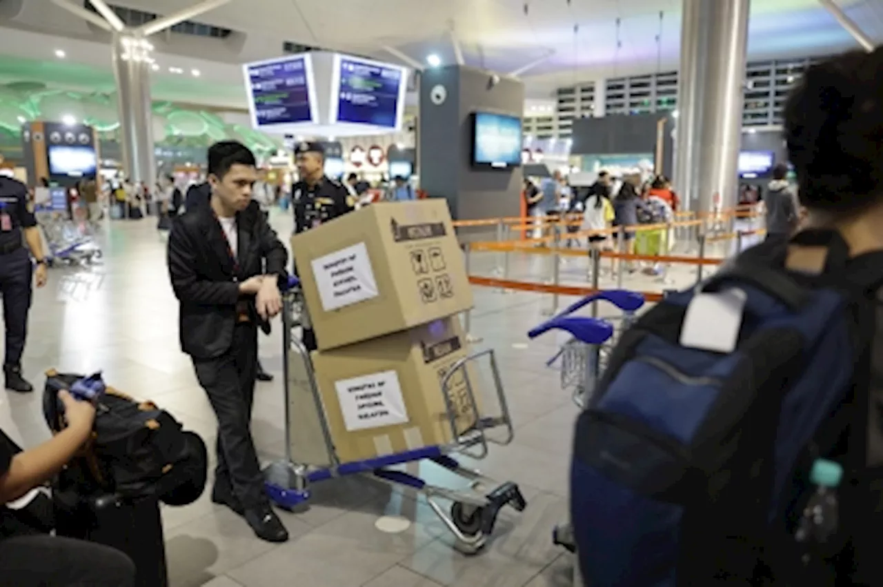 Special chartered flight carrying 123 Malaysians, including 80 students, from Bangladesh lands at KLIA 2