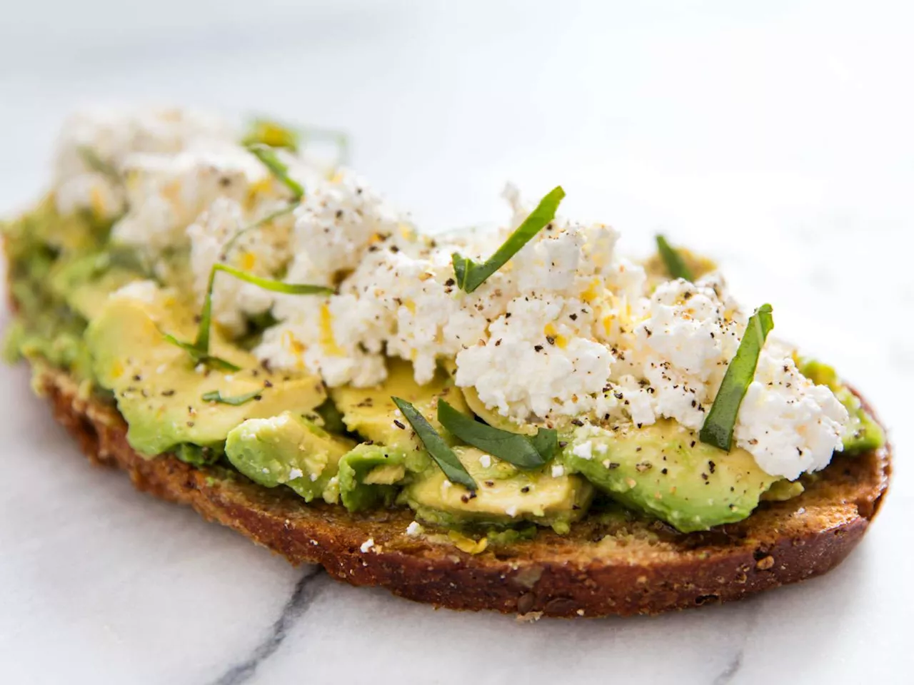 Avocado Toast With Ricotta, Olive Oil, Lemon Zest, and Basil Recipe