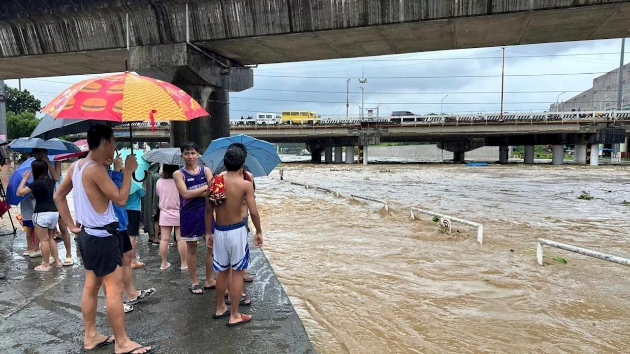 Taiwan prepares for a strong typhoon that worsened monsoon rains in the Philippines, killing 12