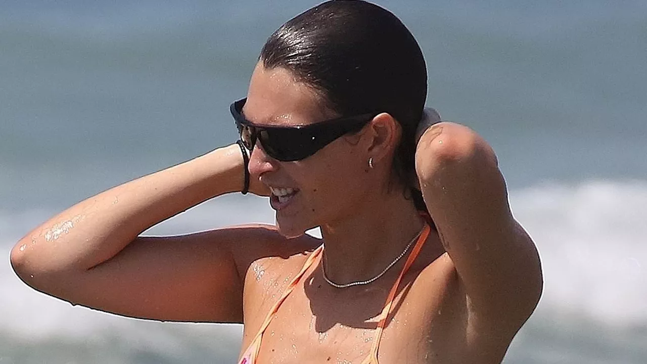 Leonardo DiCaprio's girlfriend Vittoria Ceretti flaunts her model figure in a tiny pink bikini as...