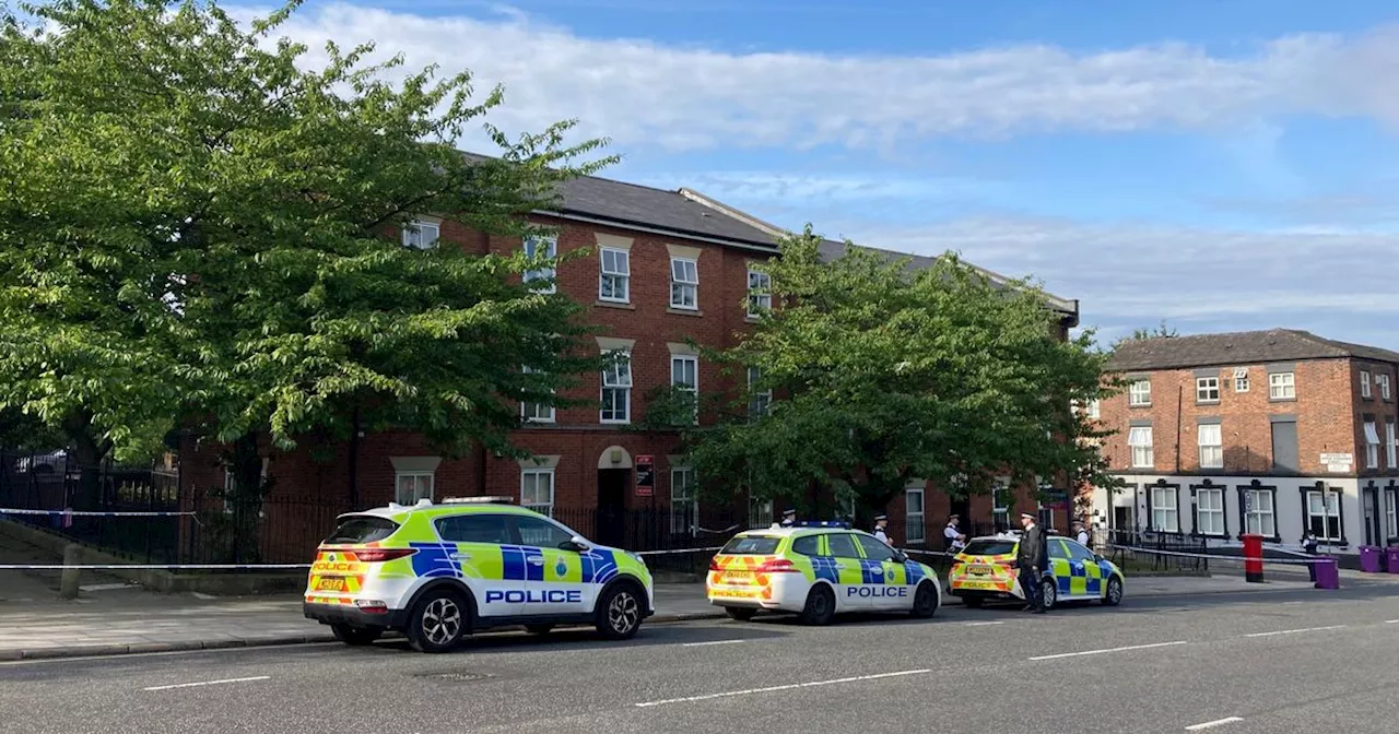 Live updates as police cordon off flats on major city road