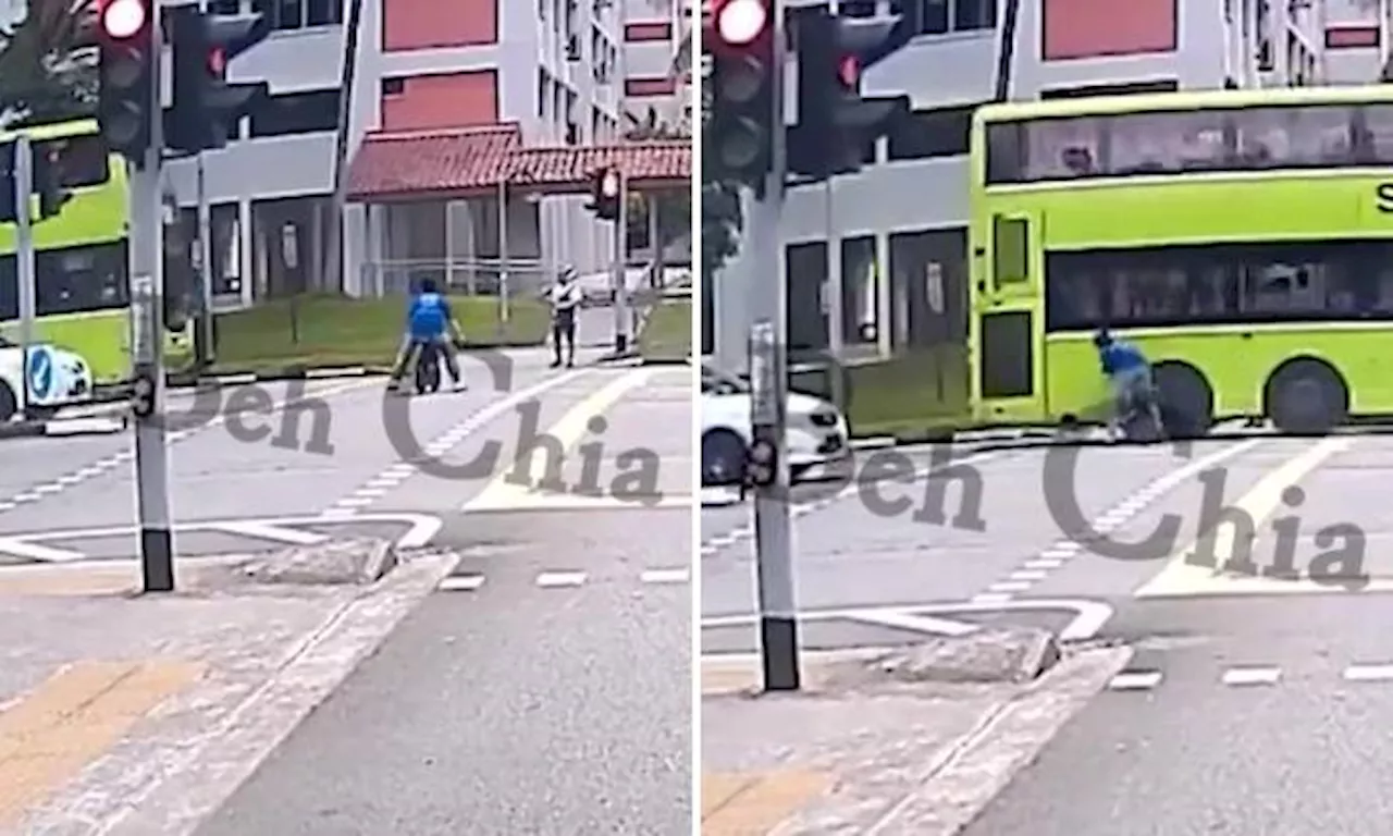 PMD user ignores red light, rides into moving bus at Yishun crossing and survives