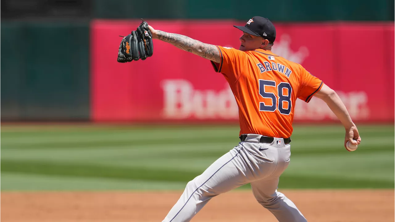 Astros thump Athletics behind Brown to avoid series sweep