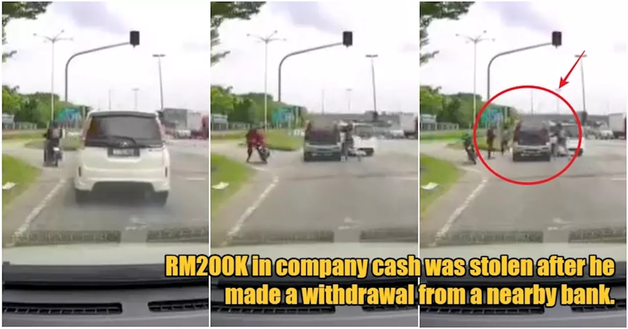 Dashcam Footage Captures Man Getting Robbed of RM200K in Broad Daylight at Shah Alam Traffic Light