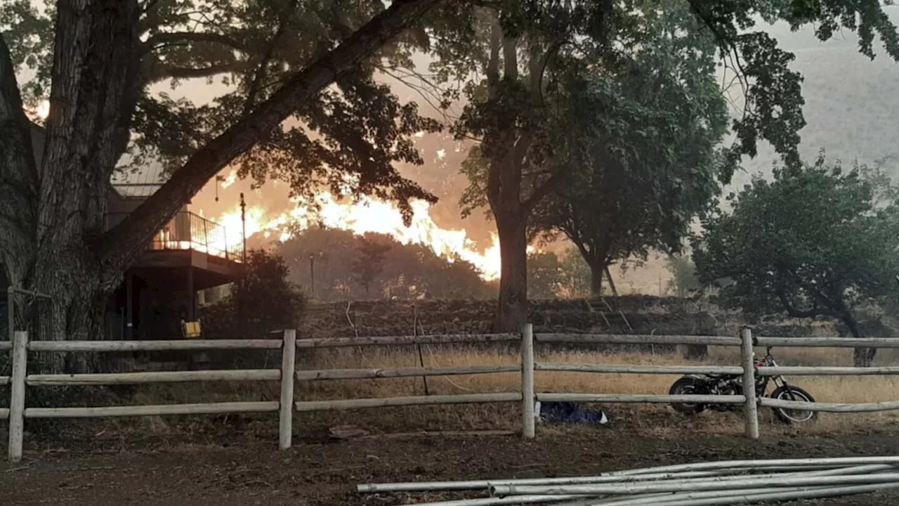 Wildfires prompt California evacuations as crews battle Oregon and Idaho fires stoked by lightning