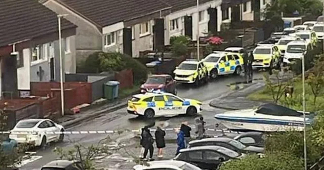 Armed cops swarm East Kilbride street amid ongoing incident