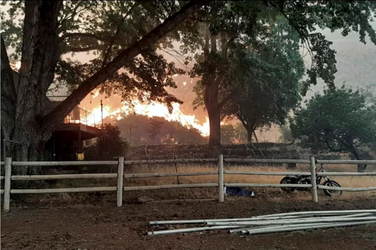 Wildfires prompt California evacuations as crews battle Oregon and Idaho fires stoked by lightning