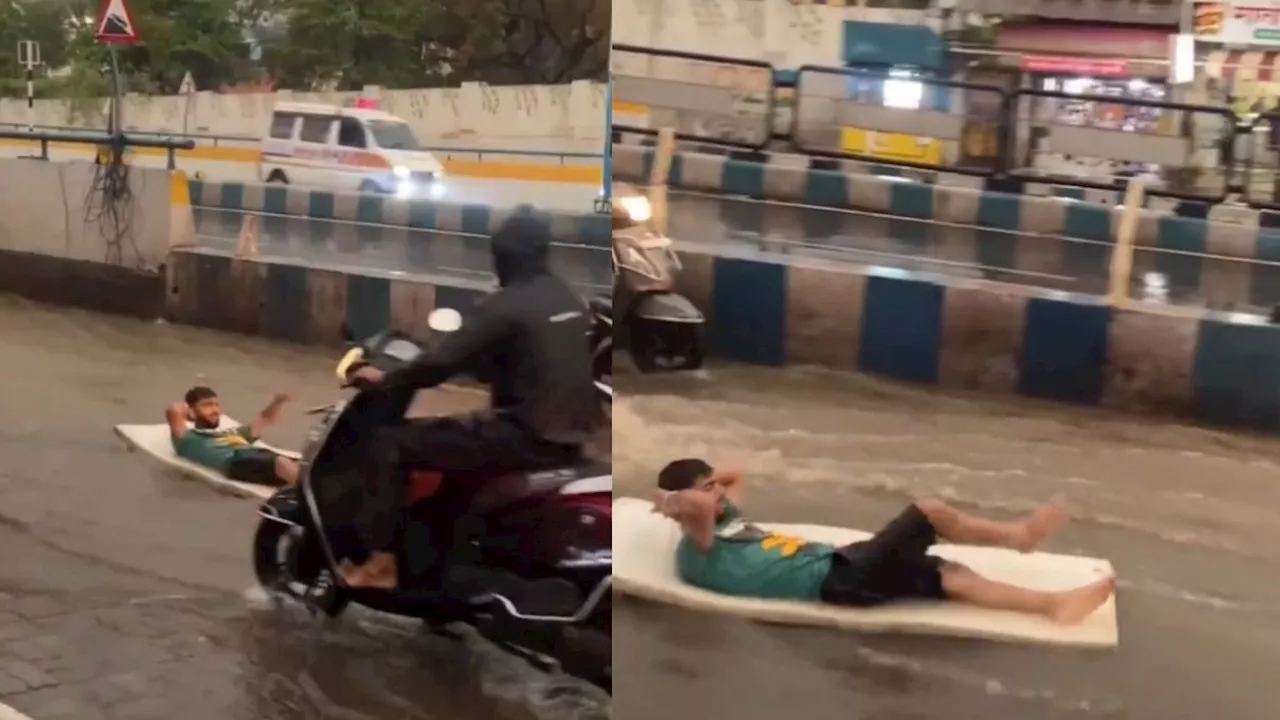 Viral Flood Video : रोड पर भरा पानी तो युवक ने किया गजब का कारनामा!