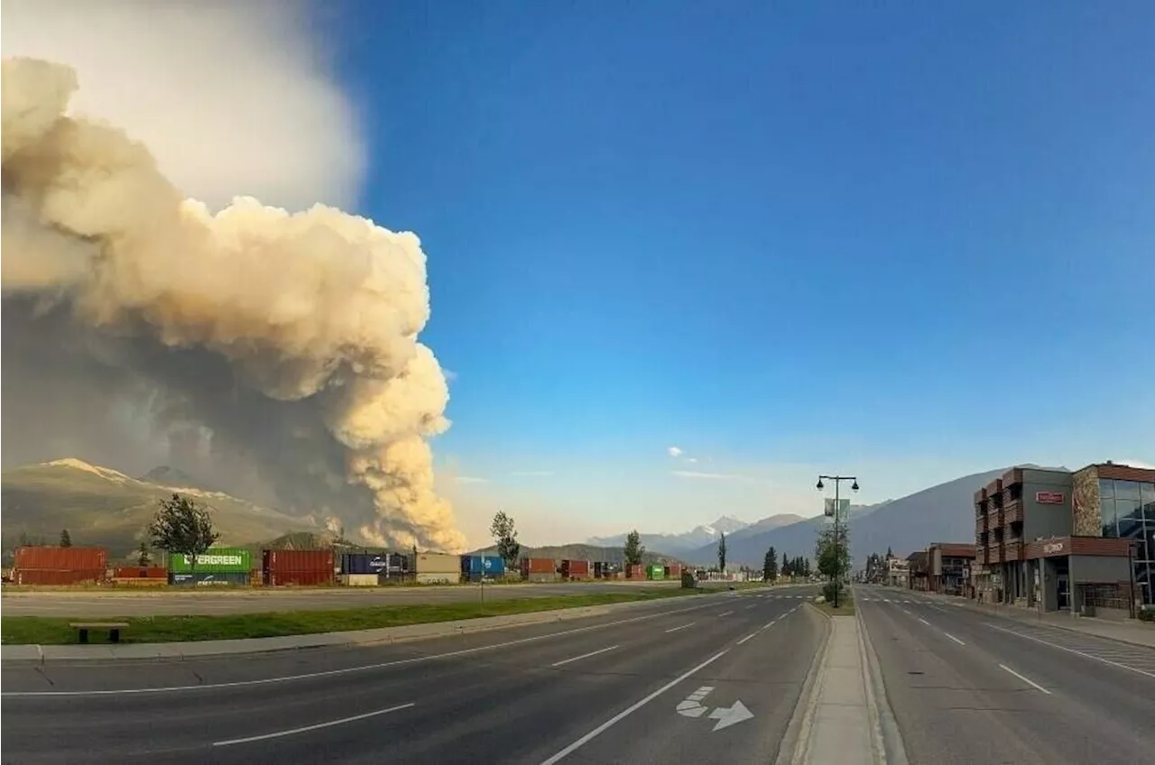 Alberta premier fights back tears as wildfire devastates iconic Jasper